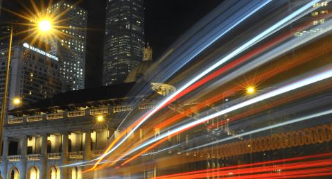 trails of lights from traffic in the Hong Kong Central District