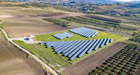 Photovoltaic system on a field in a hilly landscape