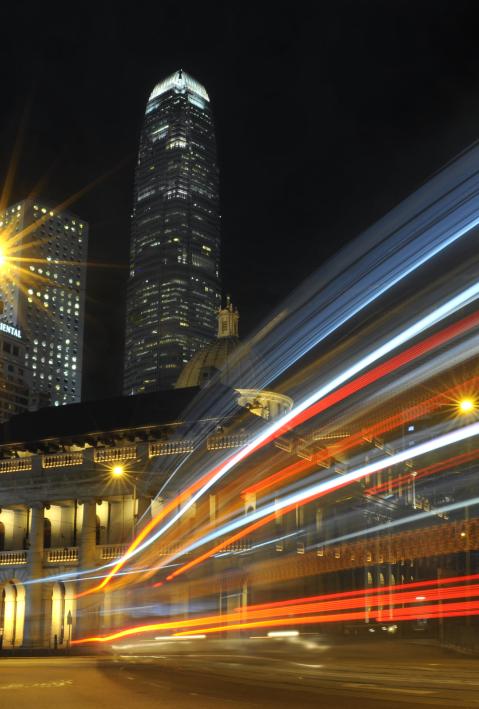trails of lights from traffic in the Hong Kong Central District