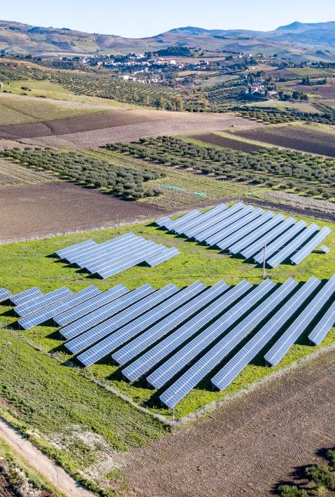 Photovoltaic system on a field in a hilly landscape