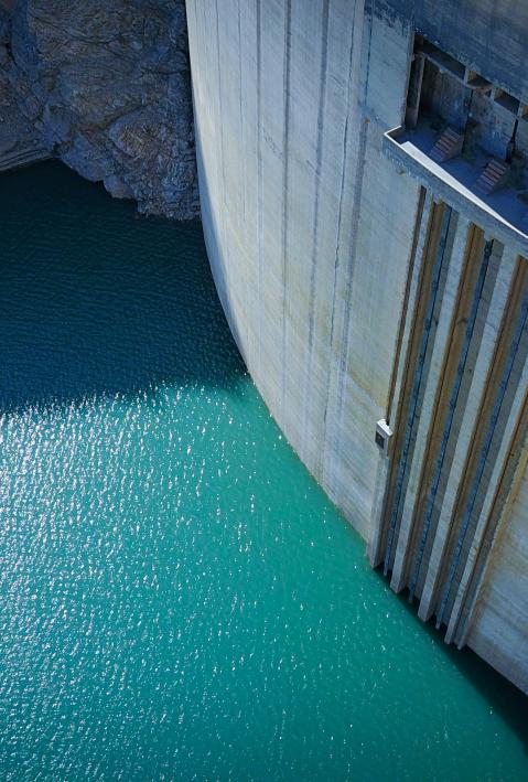 dam wall surrounded by water