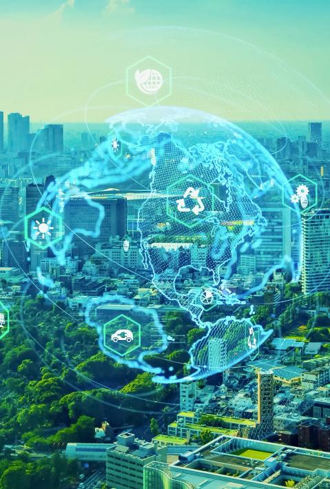 Photo of a city in the background and abstract connecting lines and a globe in the foreground. 