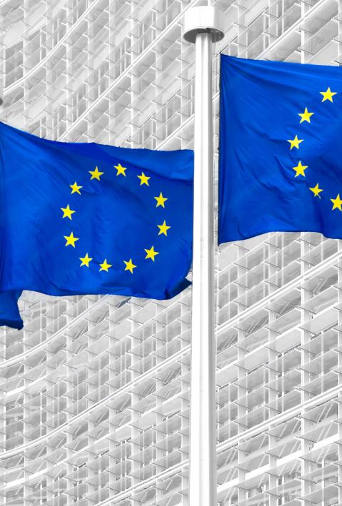 EU flags in front of European Commission in Brussels