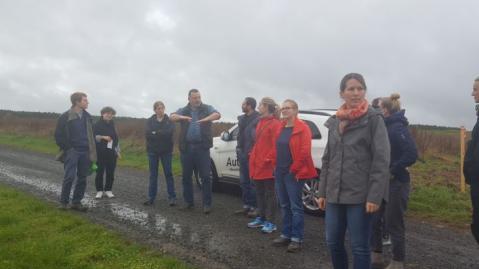 CAP4GI project team meets with a farmer in his field