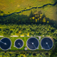 Sustainable water recycling sewage treatment plants shot from above within a green landscape