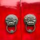 heavy red door with two dragon door knocker