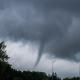 Kaunas, Lithuania - 08 20 2017: Small tornado seen above a group of trees.
